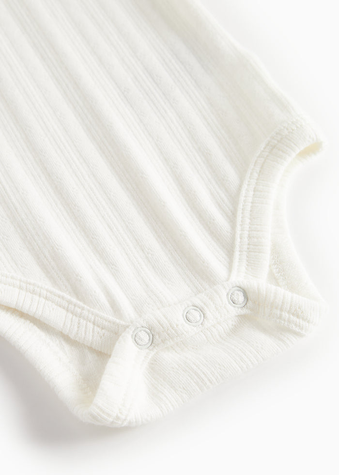 White pointelle body for children with long sleeves