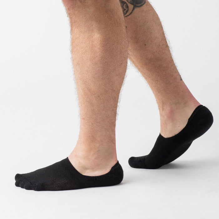 Black Never Show Socks 6-Pack on feet, featuring individual toe compartments.