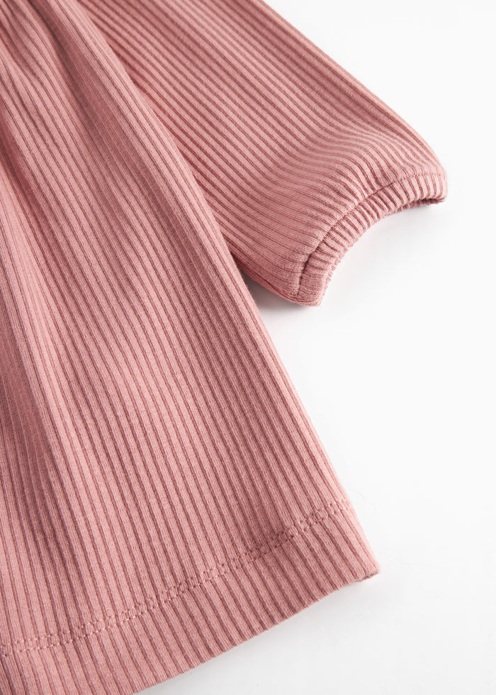 Pink ribbed dress with long sleeves, buttons and ruffles for children