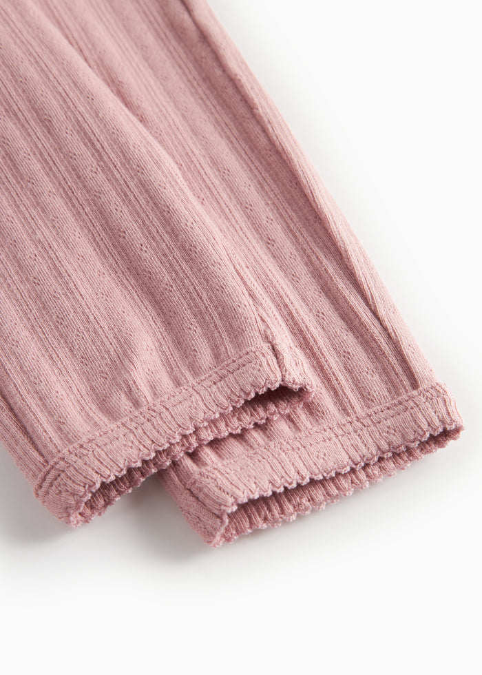 Pink pointelle trousers for children with ties and ribbed edges