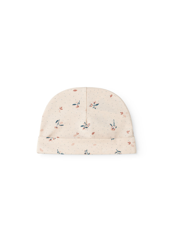 Beige babyhue med små blomsterprint og foldet kant