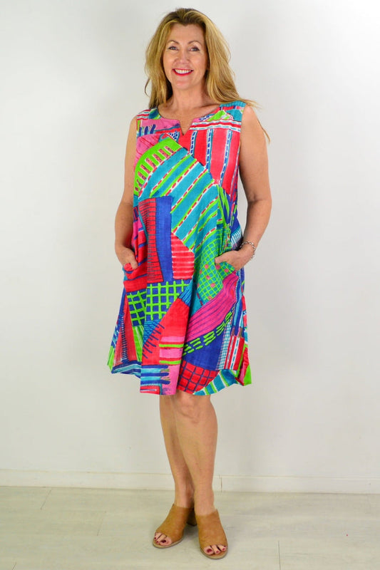 Orientique Amalfi shift tunic dress hanging on a hanger, featuring lightweight fabric and a relaxed fit, ideal for casual wear.