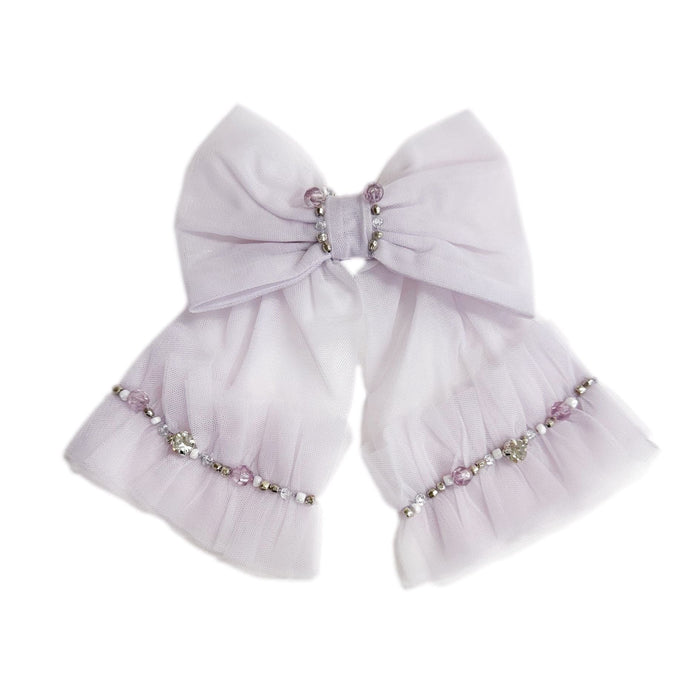 Lavender tulle hair bow with rhinestone detail and secure clasp. Elegant accessory designed to match the Ariel Dress for special occasions.