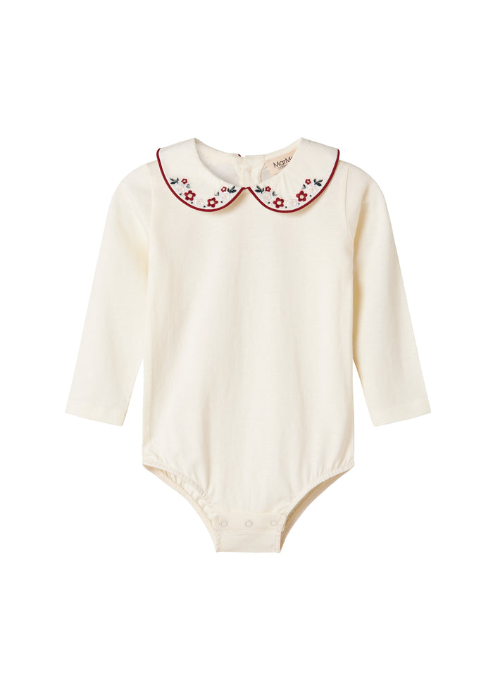 White bodystocking with collar and fine floral embroidery for baby