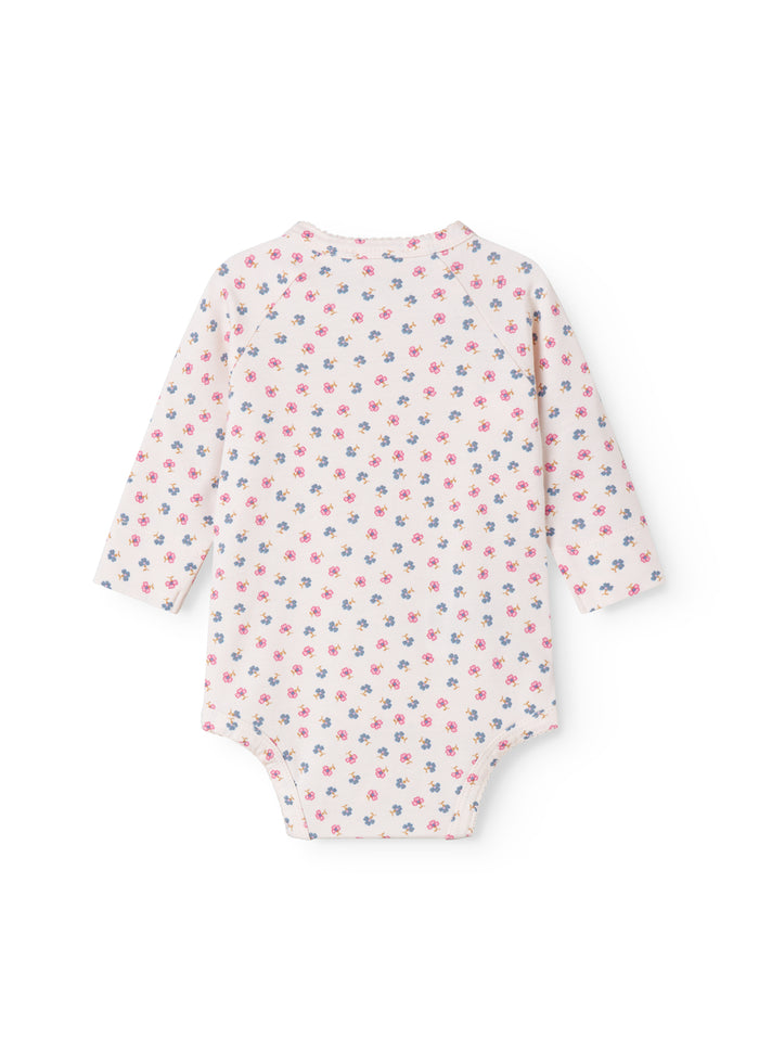 Langærmet bodystocking for a newborn baby with snap closure and flowers.