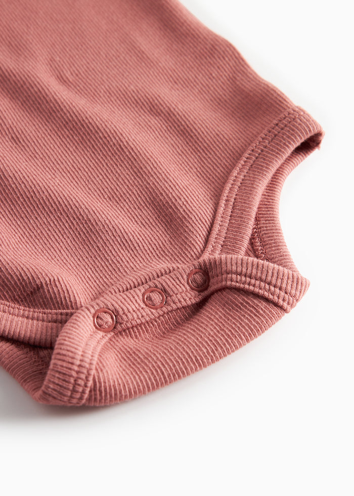 Dusty pink ribbed long-sleeved bodysuit for baby