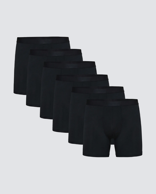 Set of six black boxer briefs on a light gray background