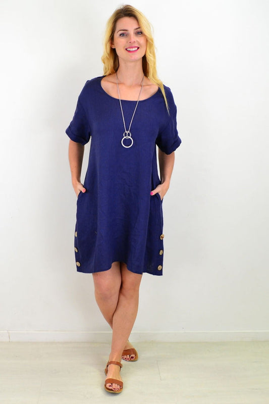 Blue natural linen tunic shift dress by Cali&Co, showing a relaxed fit with long sleeves and a simple round neckline.