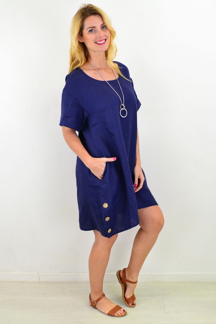 Blue natural linen tunic shift dress by Cali&Co, shown on a hanger with a relaxed fit, lightweight and breathable fabric.