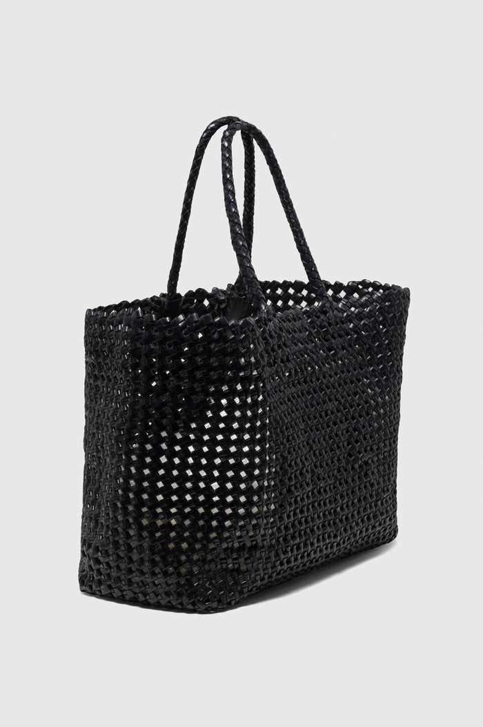 Brava Tote in Woven Leather With Top Handles and Spacious Interior in Black Colorway - side view, off model.