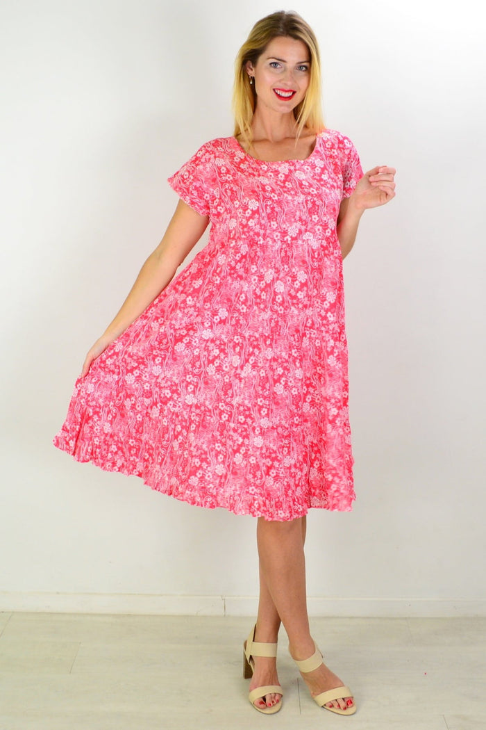 Orientique Cappadocia tiered boho tunic dress with colorful patterned fabric and flowing silhouette displayed on a dress form.