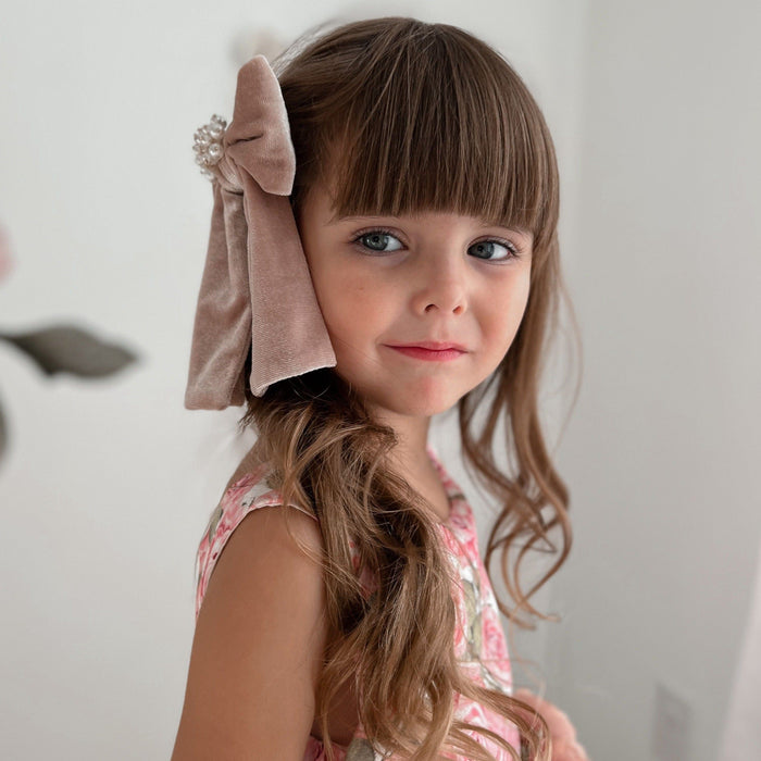 Side view of Dusty Pink Velvet Hair Bow showing dimensional bow shape and softly draped velvet tails