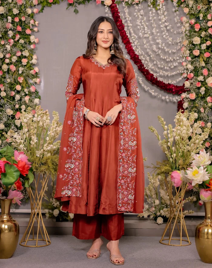 Woman in a red traditional outfit with floral decorations in the background