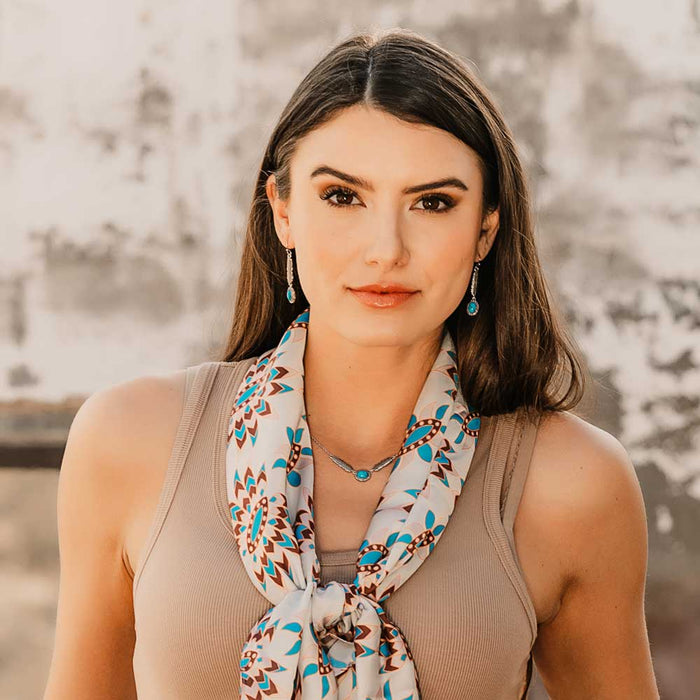 Woman wearing scarf and jewelry