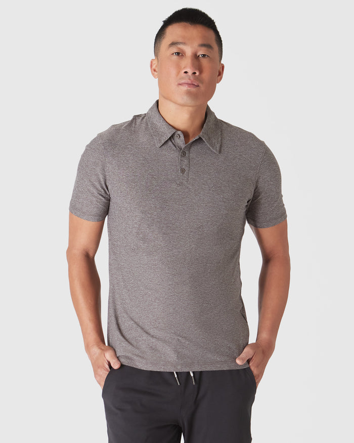 Heather Cocoa Active Polo 2.0 worn by man against light background.