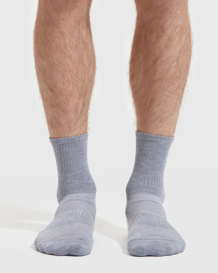 Heather Gray Half Crew Socks on feet, showcasing seamless toe and contour seam.