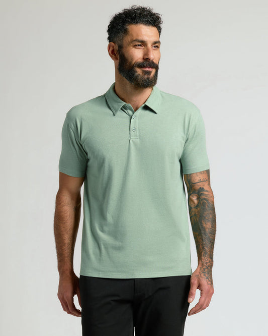Heather Slate Green Classic Polo on male model with tattoos.