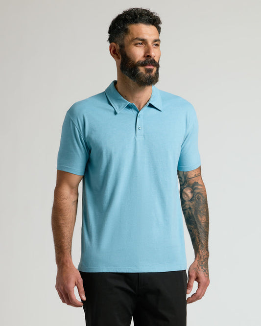 Heather Voyager Short Sleeve Polo on man with tattooed arm.