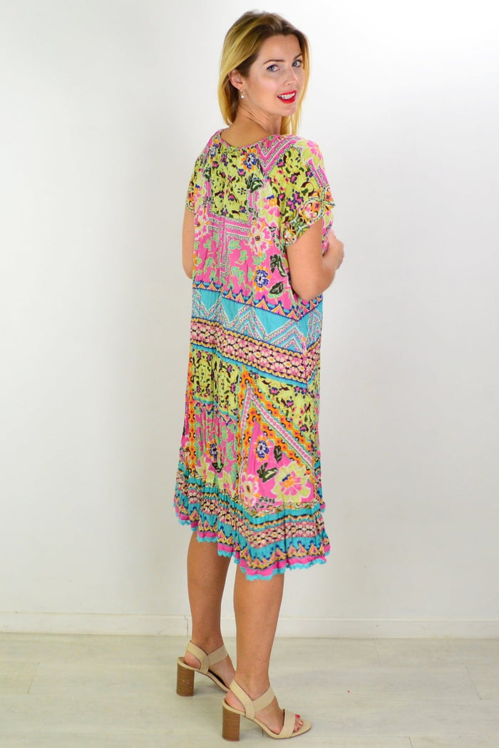 Orientique Iruya Crinkle Tie Neck Tunic Dress shown, featuring a relaxed fit, crinkle fabric, and tie detail at the neckline.