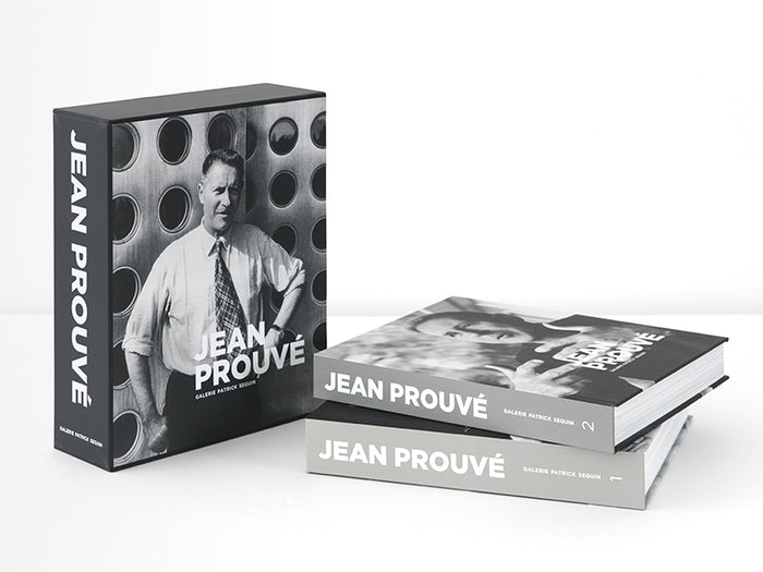Slipcased book with black and white photograph of Jean Prouve on the cover, titled 'Jean Prouve' with two books shown outside of slipcase.