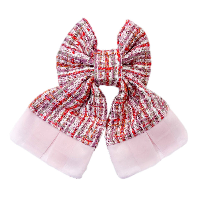 Kellie Pink Tweed Hair Bow featuring oversized structured bow design with soft pink and red woven tweed fabric and layered tulle trim – luxury girls statement hair accessory.