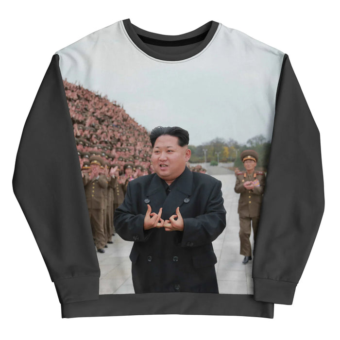 A photorealistic print shows a North Korean political leader in a black trench coat, flashing an interlocking finger sign associated with street culture. Contact us with accessibility feedback, we'd love to help!