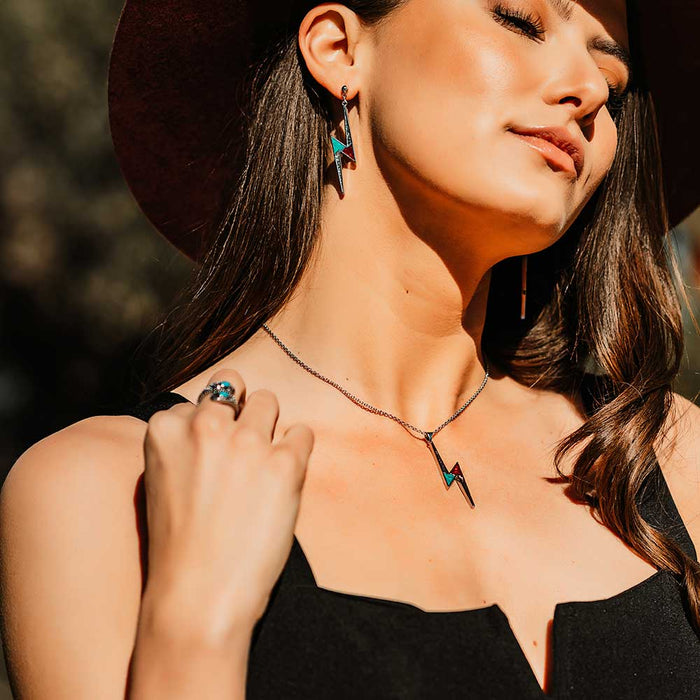 Woman wearing lightning bolt jewelry