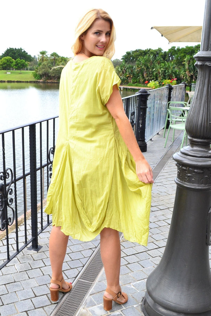 Lime cotton Sophia tunic dress by Cordelia St, featuring a relaxed fit and stylish design, displayed on a hanger.