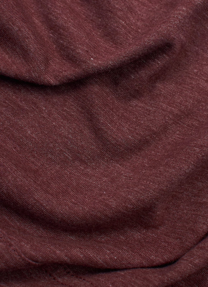 Close-up of the LS Hooded Logo Tee in maroon, showing its textured fabric and natural folds.