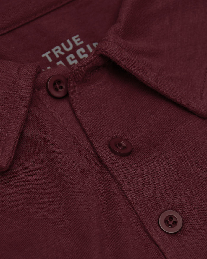 Mahogany Polo with knit texture and three-button placket.