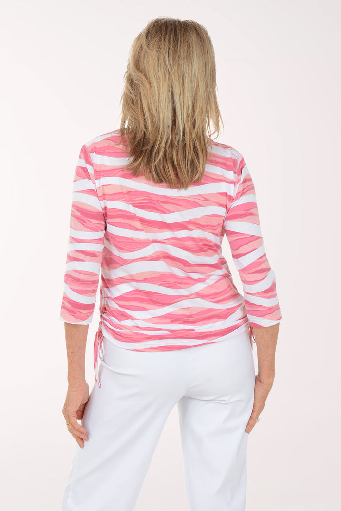 Woman wearing a pink and white striped shirt on a white background