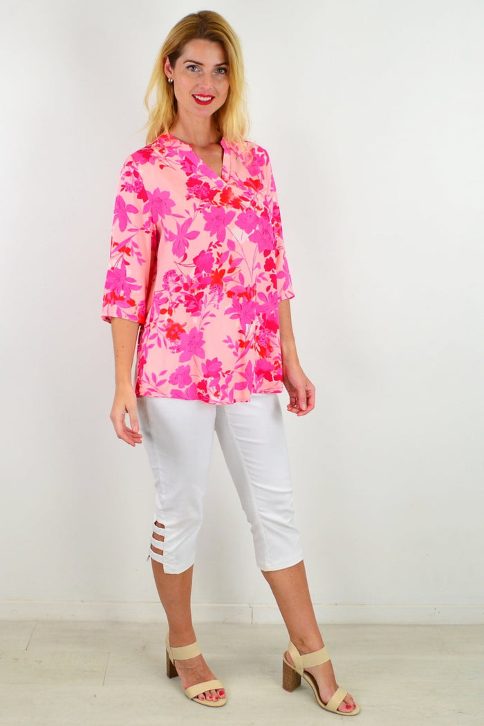 Floral tunic top by I Love Tunics featuring vibrant pop of color, lightweight fabric, and relaxed fit, perfect for casual wear.