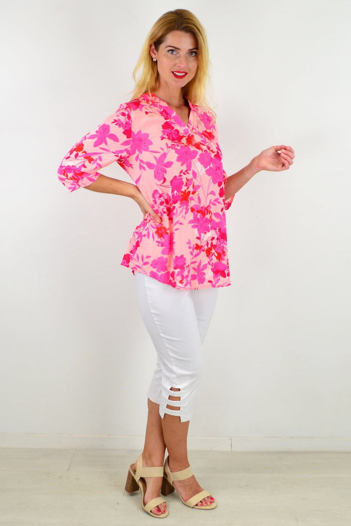 Colorful floral I Love Tunics tunic top with a relaxed fit, featuring vibrant flower patterns and lightweight fabric.
