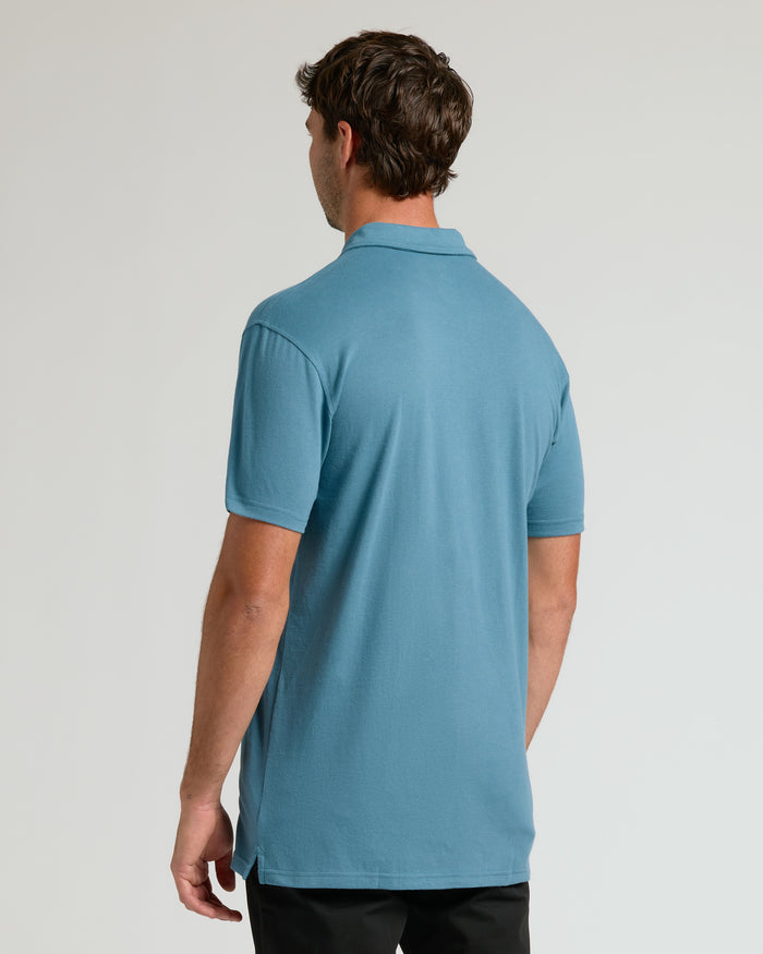 Back view of man in Sapphire Short Sleeve Tall Polo.