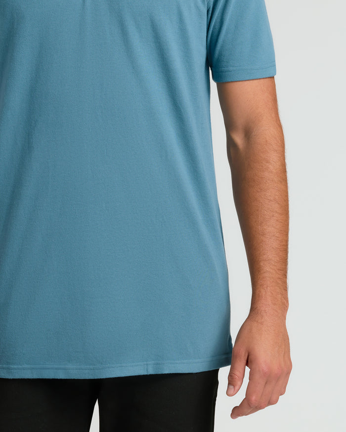 Sapphire Short Sleeve Tall Polo worn with black bottoms.
