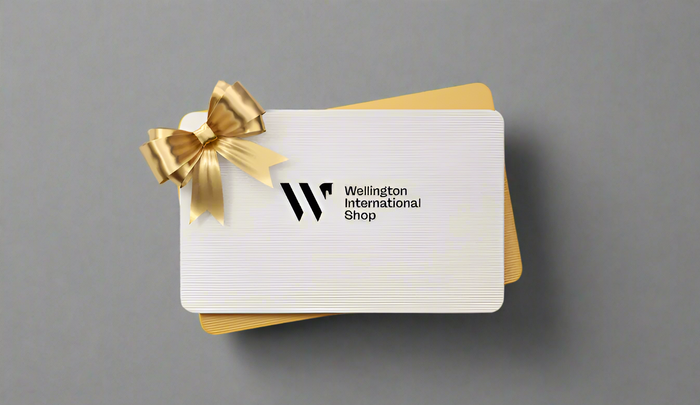 Gift card with gold bow and 'Wellington International Shop' logo on a grey background