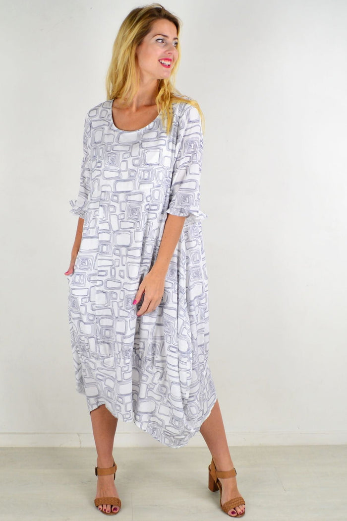 White block bubble tunic dress from Willow Tree, featuring a loose fit and casual style, displayed on a hanger.