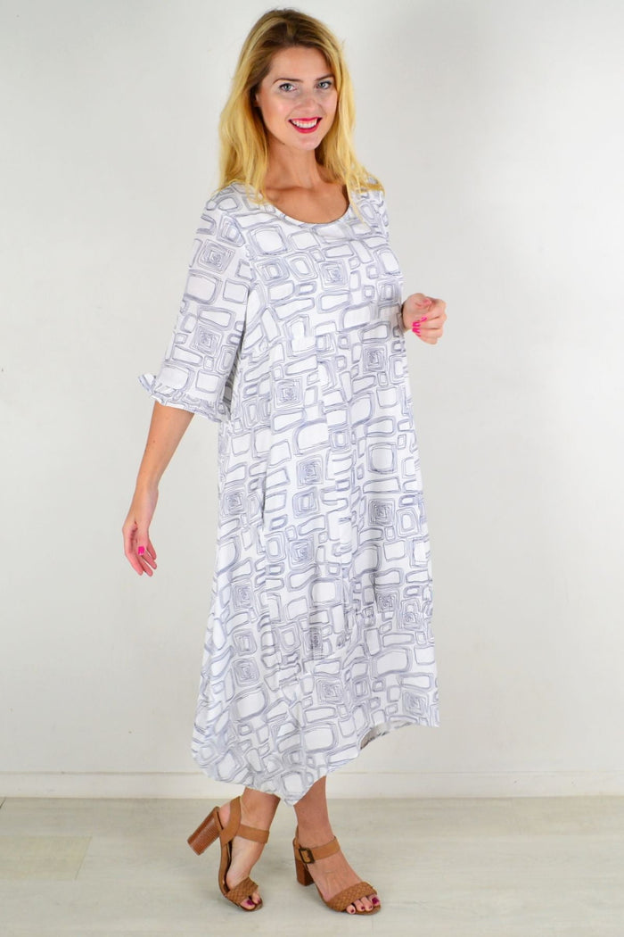White Block Bubble Tunic Dress by Willow Tree, featuring a loose fit, bubble silhouette, and long sleeves, displayed on a hanger.
