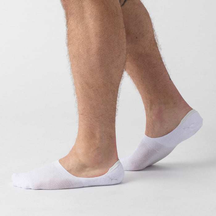 White Never Show Socks 6-Pack on model's feet, highlighting fit and design.