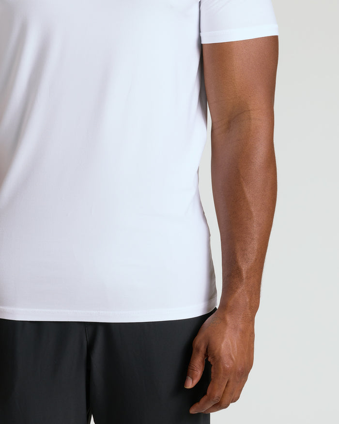 White Tall Active Crew Neck 2.0 on model's torso, black bottoms.