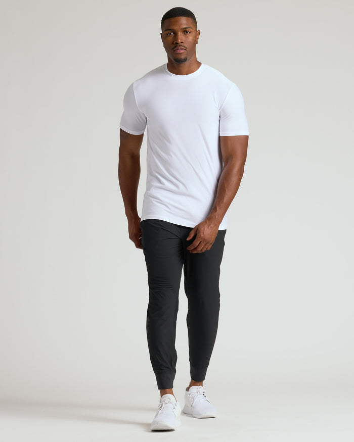 White Tall Active Crew Neck 2.0 on athletic man, relaxed pose.