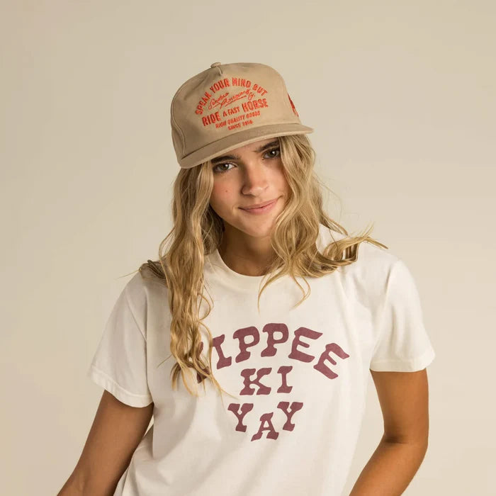 Studio model wearing Yippee Ki Yay tee and hat, FW23 collection.